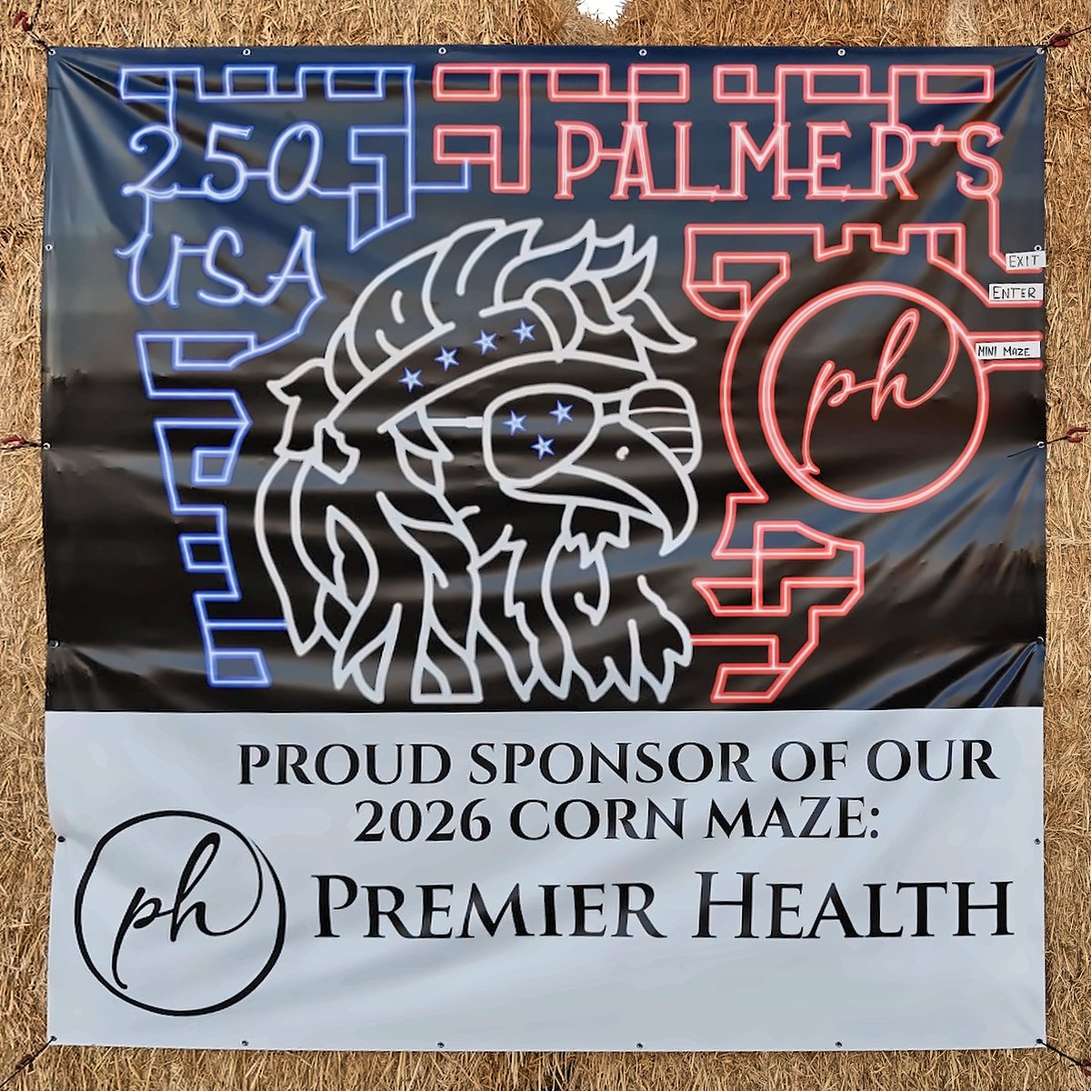 Premier Health sponsor banner showing the 2026 250 USA eagle corn maze design at Palmer's Adventure Farm